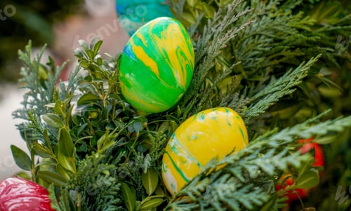 Preview: Selective focus of colorful Easter eggs on a tree in a park