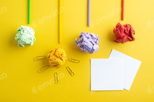 Preview: top view colorful squeezed papers with sticks on yellow background paper college color photo drawing