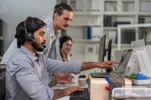 Preview: Asian professional businessman using laptop computer video call in office.