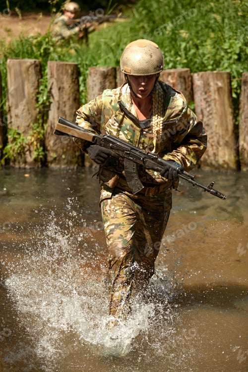 Preview: Full military experience - One day commando - running through the water with automatic rifle replica