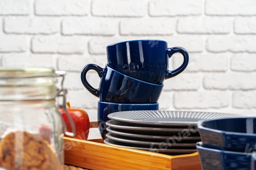 Preview: Classic blue empty ceramic tea cup on kitchen table