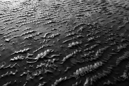 Preview: Beach sand at low tide and natural ripple patterns.