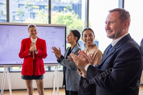 Preview: Business Team Applauding After Successful Presentation