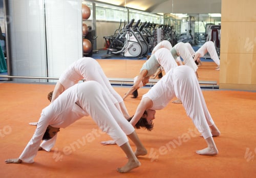 Preview: People practicing yoga together in class