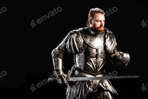 Preview: handsome knight in armor holding sword isolated on black