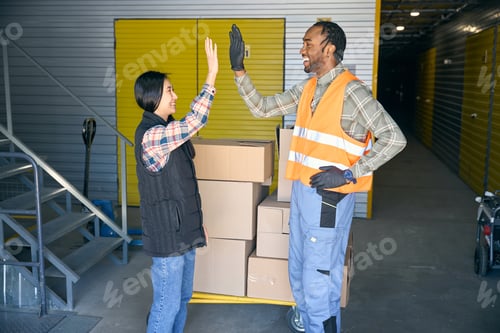 Preview: Team of storehouse coworkers greeting one another before cargo unloading
