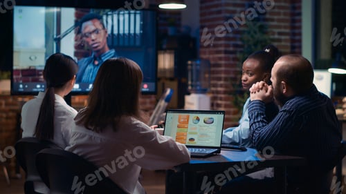 Preview: Employees listening to remote team leader in videoconference