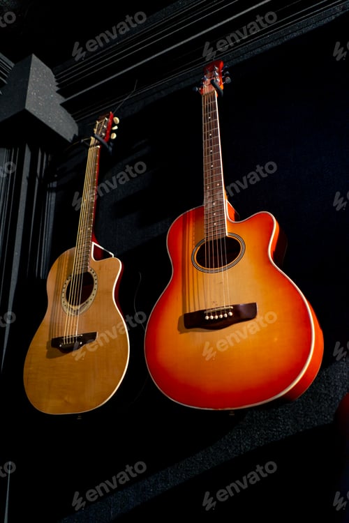 Preview: Classical acoustic guitar made of wood hanging on the wall in a music studio for recording