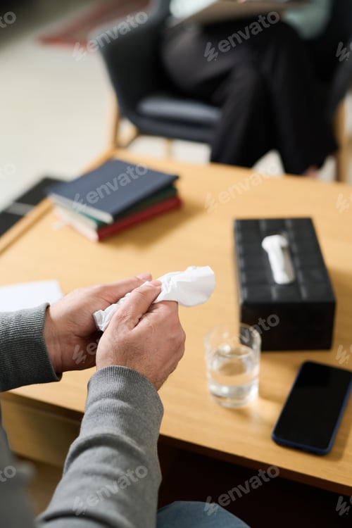 Preview: Holding Tissue in Hand During Emotional Conversation