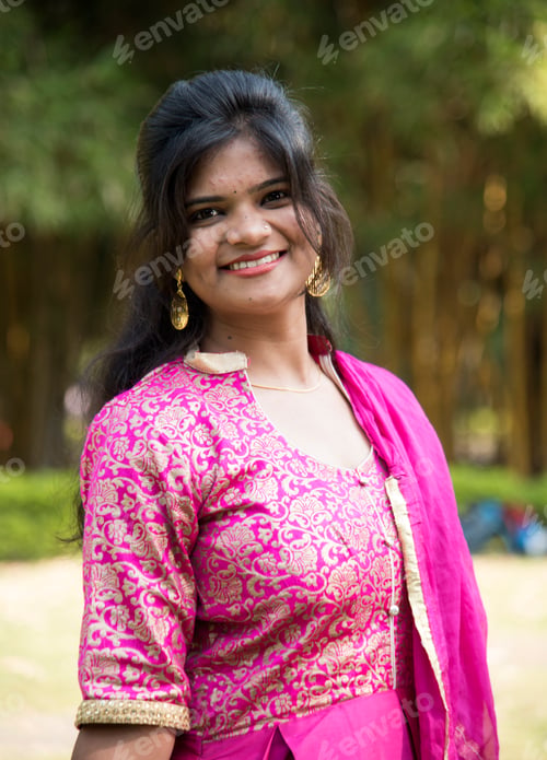 Preview: Outdoor portrait of beautiful young Indian girl in traditional dress.