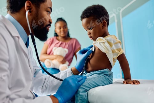 Preview: Small black kid being examined with stethoscope during medical checkup at pediatrician's.