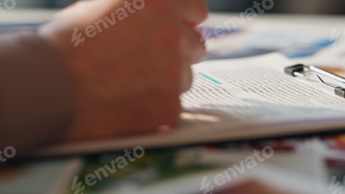 Preview: Man hand checking contract holding pen on desk close up. Man reading agreement