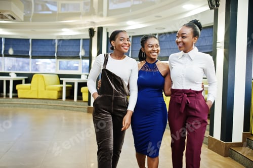 Preview: African woman in dress posing at restaurant