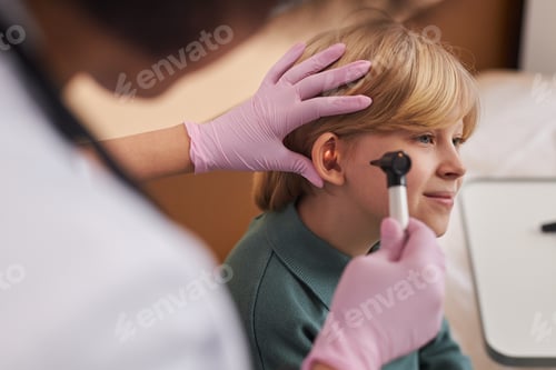 Preview: Doctor Examining Childs Ears and Hearing in Clinic