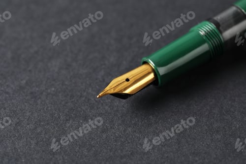 Preview: One fountain pen on dark background, macro view. Space for text