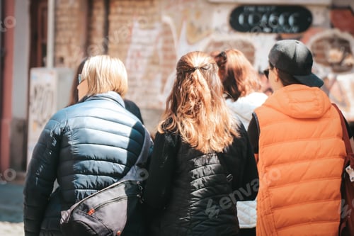 Preview: People from behind walking on the street