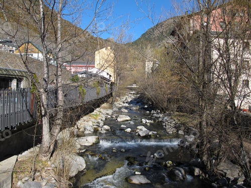 Preview: Mountain river running through the town Encamp in Andorra. Ski resort. Travel content