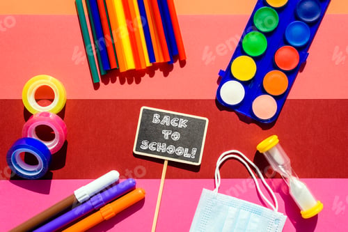 Preview: Colorful stationery isolated on colorful background for back to school viewed from above.