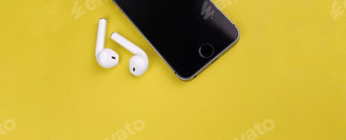 Preview: AirPods earphones with smartphone on a yellow background