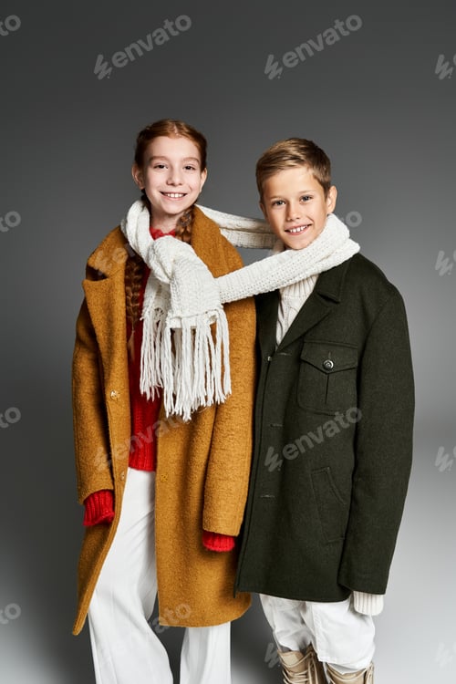 Preview: Cozy winter attire worn by children enjoying a moment of joy indoors on a chilly day