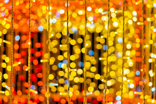 Preview: Golden Christmas lights creating magical background with soft bokeh effect. Christmas ltexture