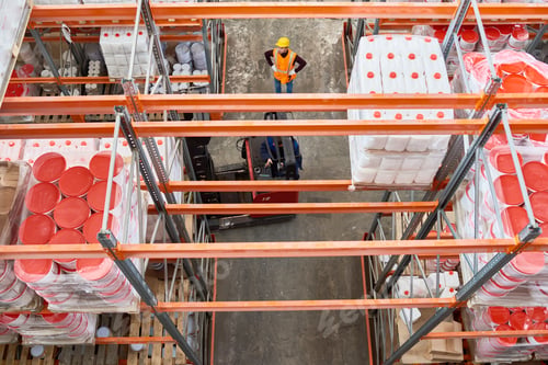 Preview: Worker Moving Goods in Warehouse