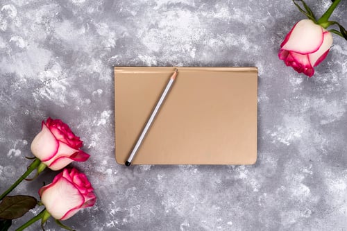 Preview: Floral frame: bouquet of pink white roses on stone background with copy space for text.