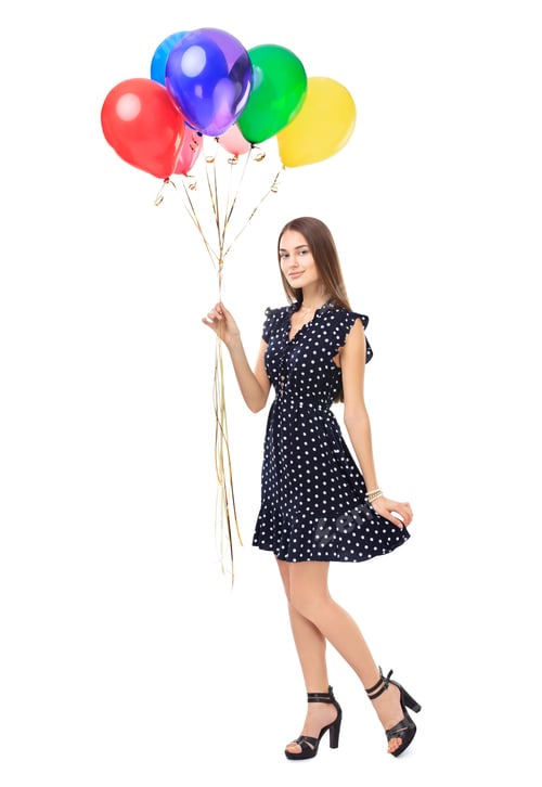 Preview: Woman in Polka Dot Dress Holding Balloons