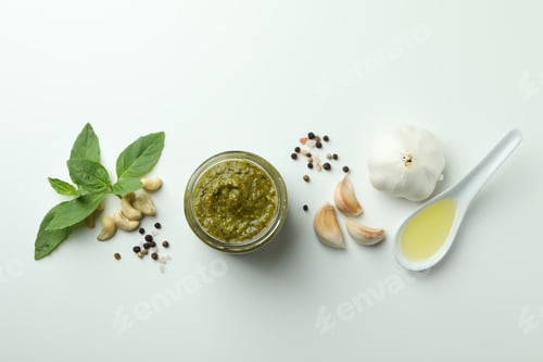 Preview: Pesto sauce and ingredients on white background