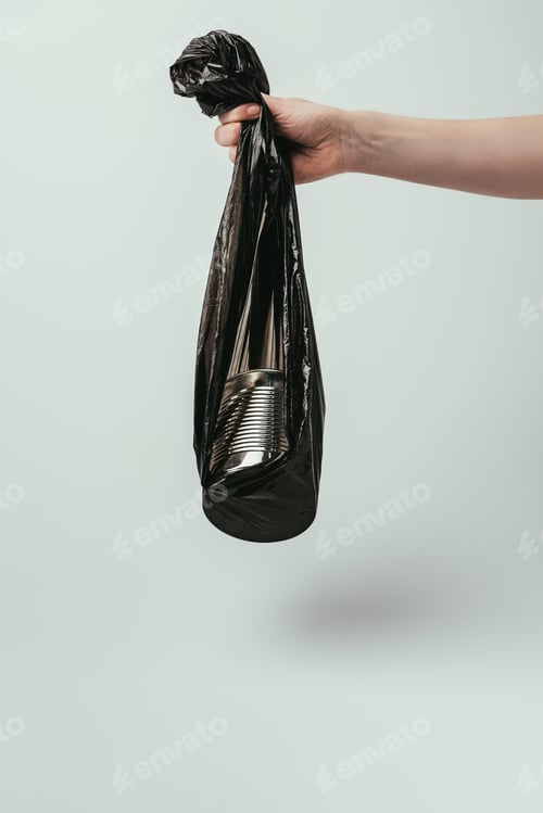 Preview: cropped shot of woman holding garbage bag with can isolated on grey