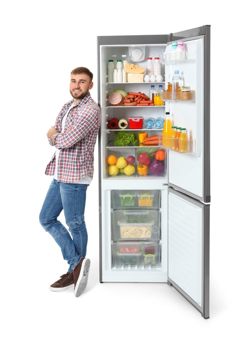 Preview: Young man near open refrigerator on white background