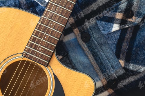 Preview: Close-up, acoustic guitar on the background of the shirt.