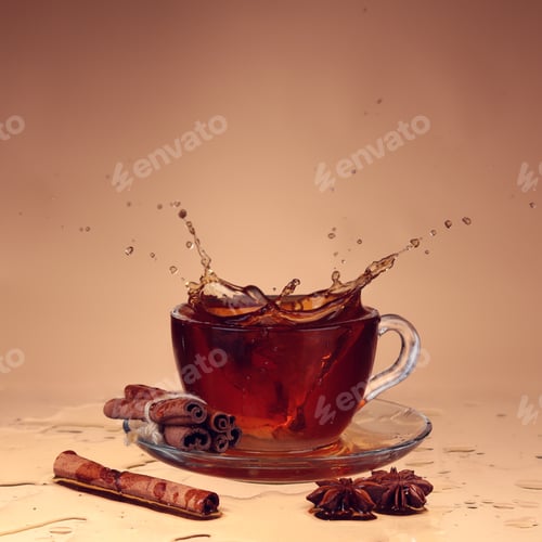Preview: Cup of tea on glass with orange background