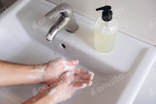 Hand Washing with Soap and Water in Sink