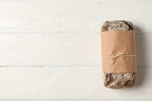 Preview: Rye bread on wooden background, space for text and top view