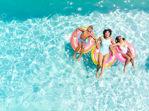 Preview: Diverse family enjoy a pool day, with copy space