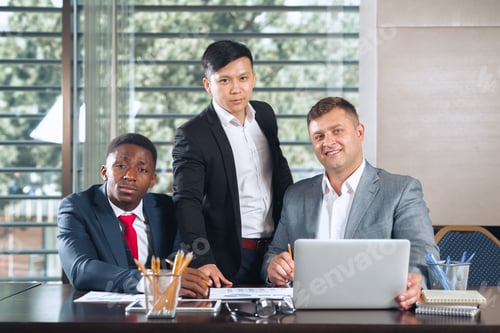 Preview: Business professionals collaborating in a modern office environment during a meeting