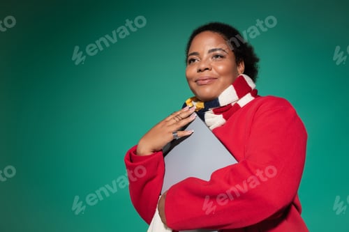 Preview: Stylish plus size woman showcases autumn fashion in vibrant studio setting