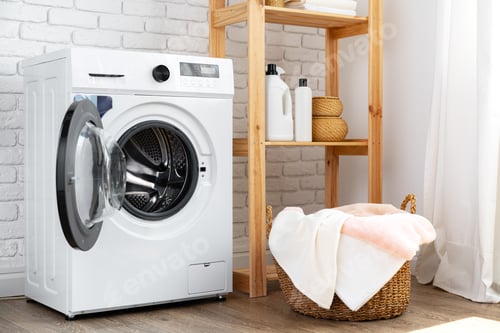 Preview: Laundry room with washing machine and basket with laundry
