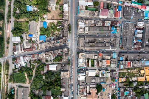 Preview: Crowded commercial building and residential in rural neighborhood and traffic on road