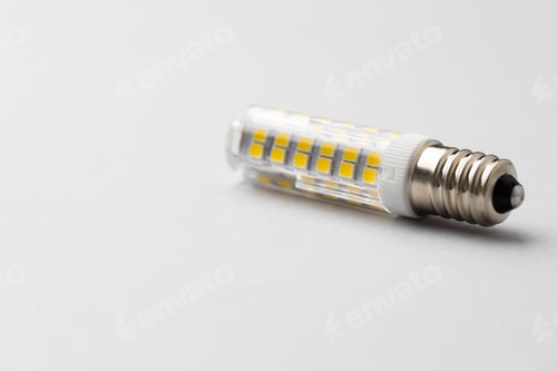 Preview: Light bulb on light grey paper background