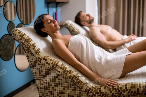 Preview: Young couple lying on the tepidarium beds