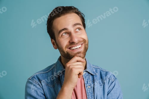 Preview: Young bristle man wearing shirt smiling and looking upward