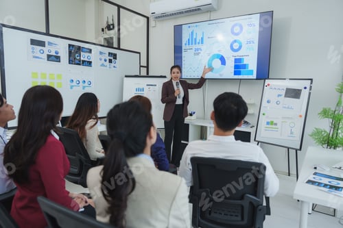 Preview: Business professional presenting data in modern office