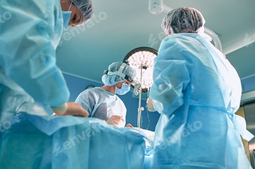 Preview: Modern surgery in a technologically advanced hospital. Bright room of intensive care. Doctors and
