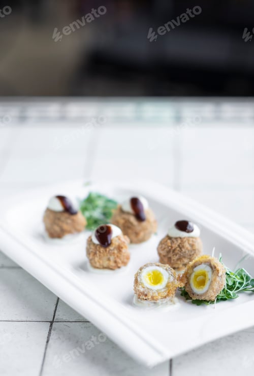 Preview: gourmet organic scotch quail eggs starter snack on table