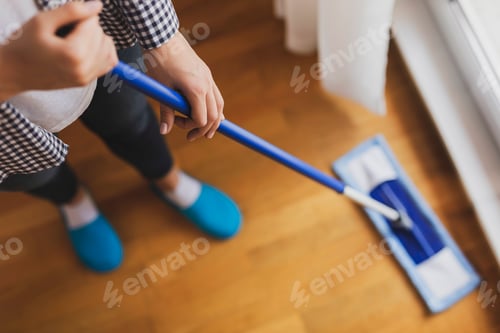 Preview: Woman wiping the floor with a floor wiper