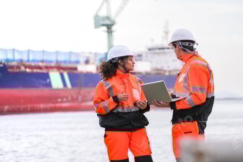 Preview: engineers communicate while inspecting dockside logistics