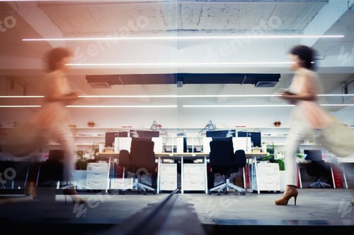 Preview: Professional business woman in motion with blur in business office