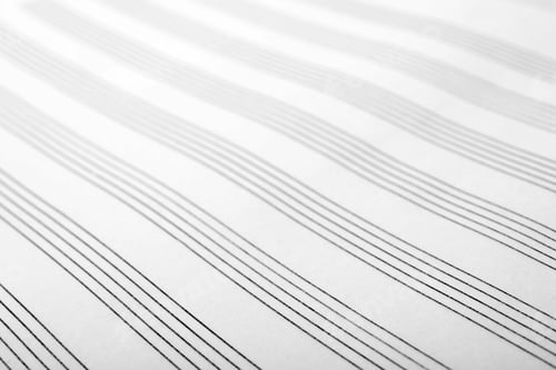 Preview: Paper with empty staves for music notes as background, closeup